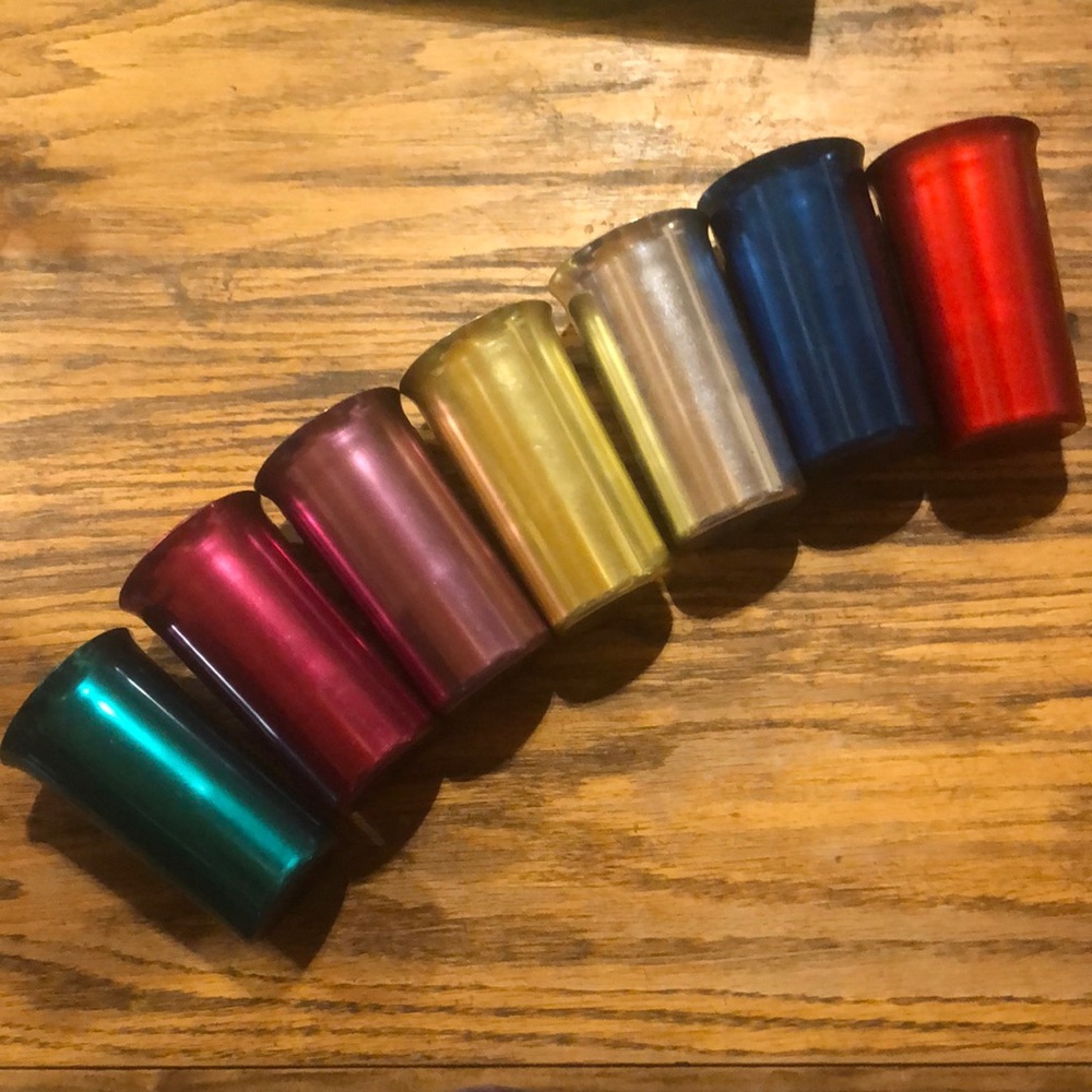 Seven Sunburst metal colored drinking glasses.  1950’s.